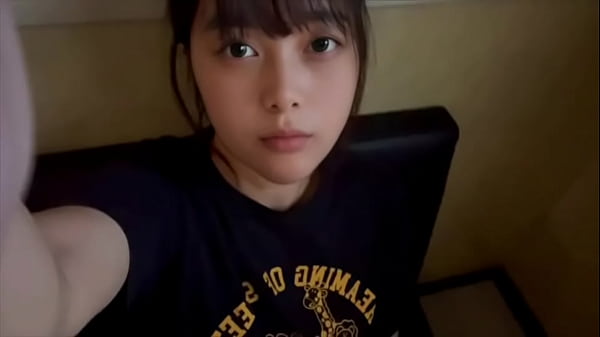 A female college student masturbates alone in a private room at a karaoke bar, using a technique she has just learned.