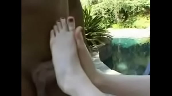 Redhead Jerking a cock with Her Feet